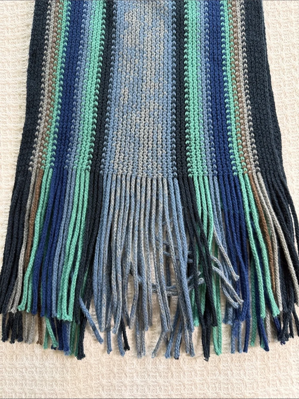 Blue and green striped knit scarf with fringe